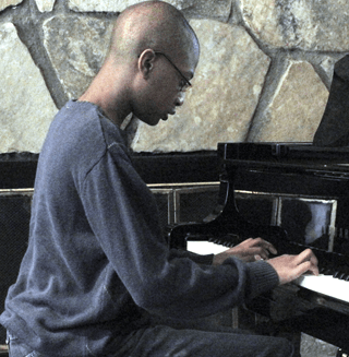 A young student at the piano