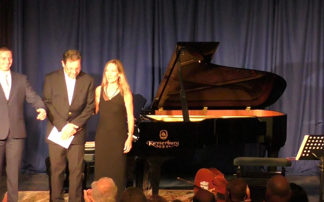 Dorian, Francisco Mireille Silva bow at piano in concert