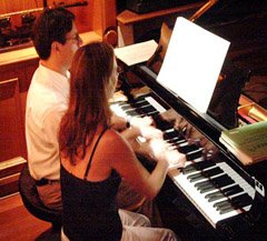 the silvas playing 4 hands together at a piano