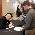 Cameron Carpenter autographs Oaks scores and organ shoe.