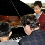 Students observing piano technique