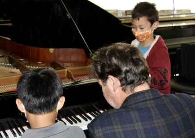Students observing piano technique